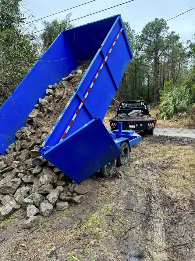 Riprap stone being delivered for drainage and erosion-control work