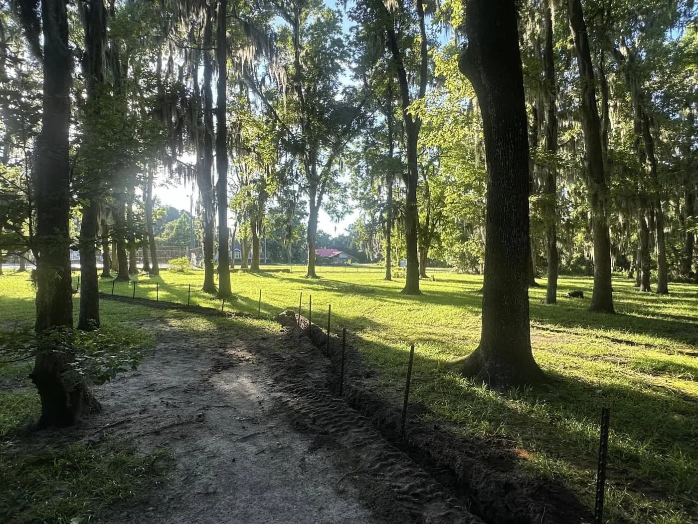 Silt fence installed along disturbed ground for erosion control
