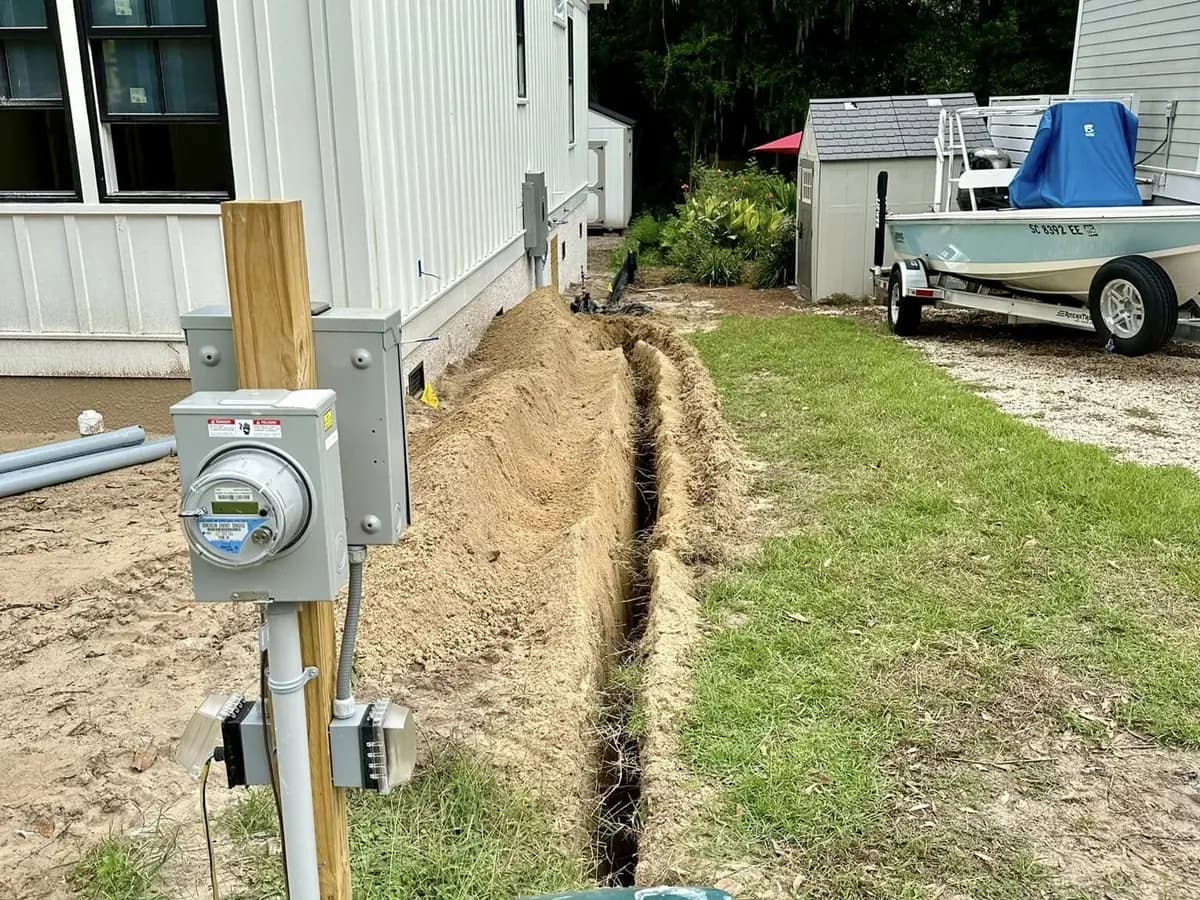 Narrow trench prepared beside a residential structure